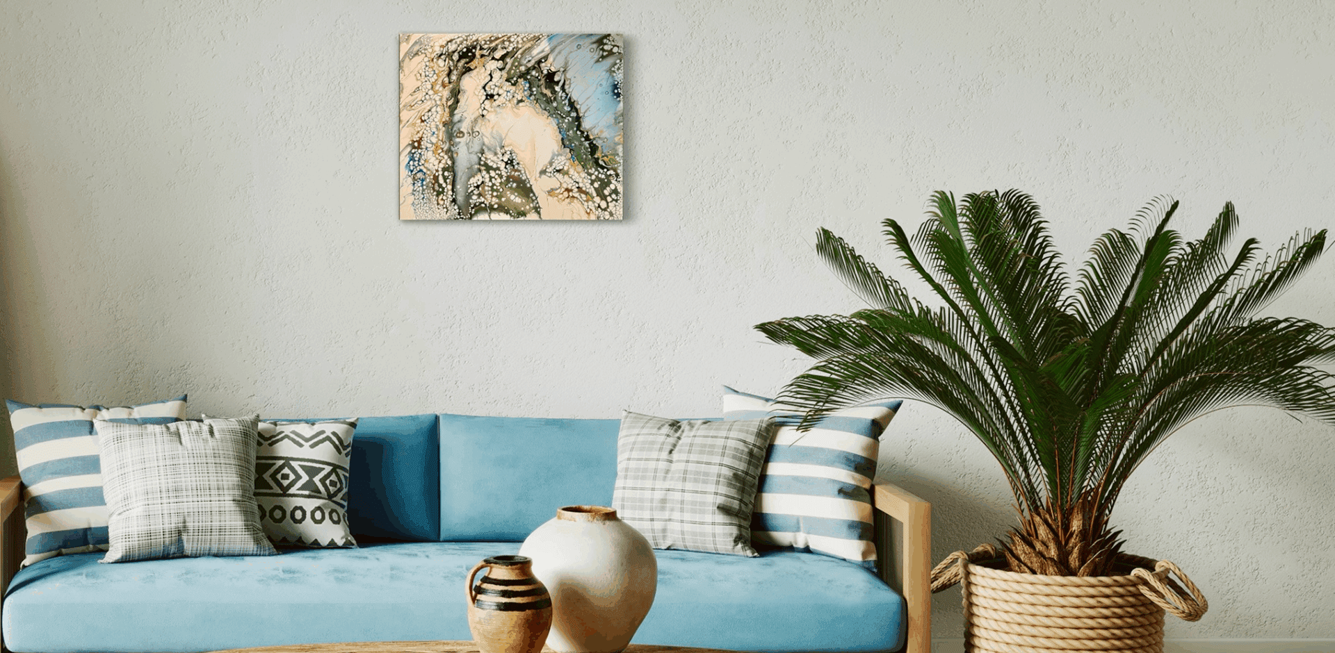 Living room with blue sofa and plant.